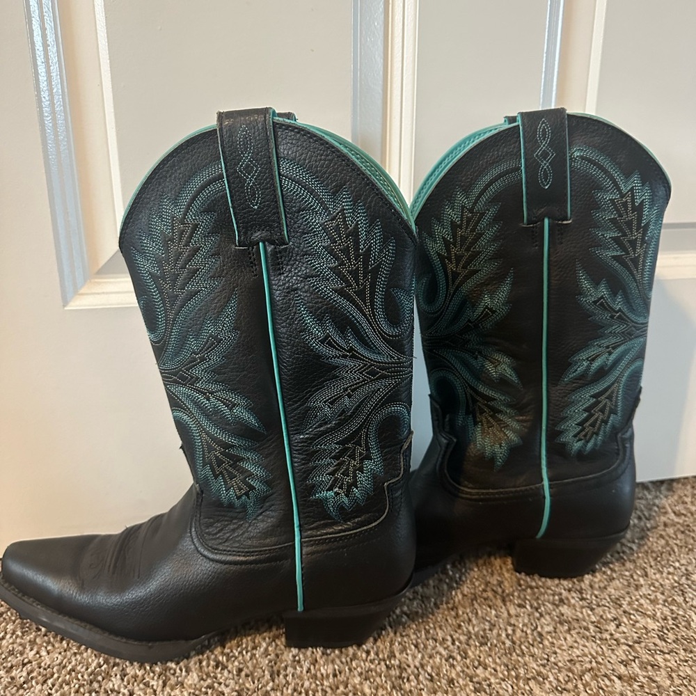 Black and teal Justin boots.